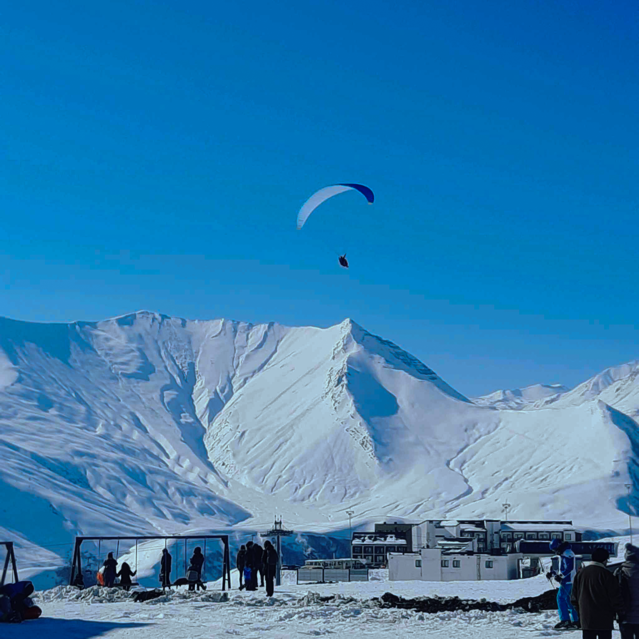 Winter season paragliding background